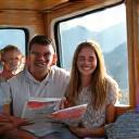 Family enjoying a campervan trip in front of Swiss mountains