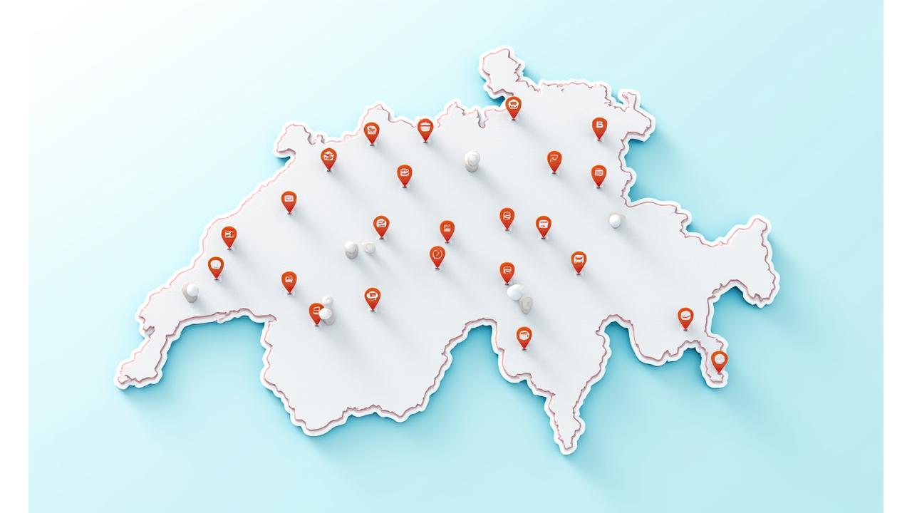 Close-up of a road map centered on Switzerland with digital pins indicating various vignette purchase locations like border crossings, gas stations, and post offices